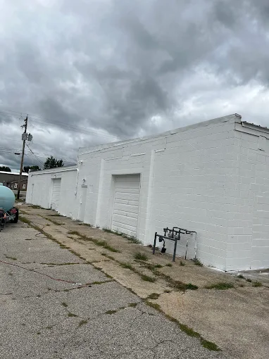 Freshly painted white farm building exterior